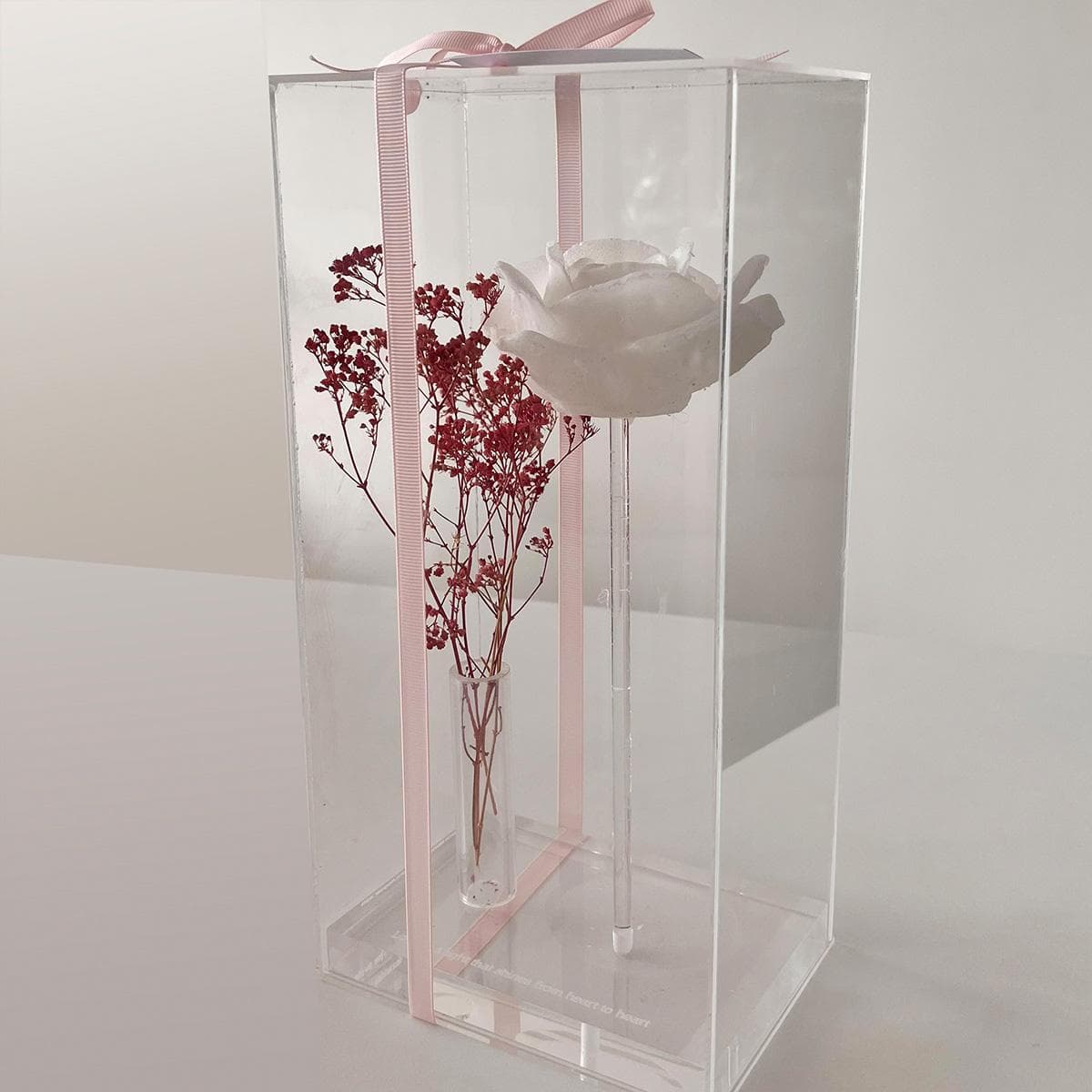 Rose shaped candle with soliflore, dried flowers and an acrtlic cover